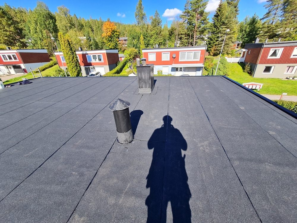 Flat Roofing Services In Ottawa. A new flat bitumen roof was installed on the house.