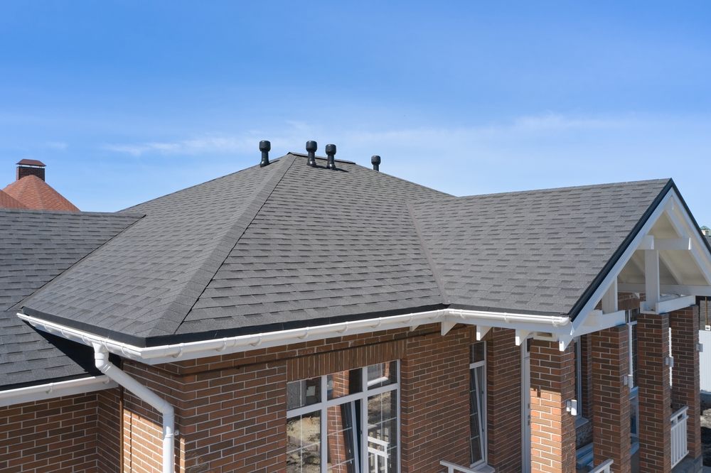 Asphalt Shingle Roofing Services In Ottawa. House roof with asphalt shingles.